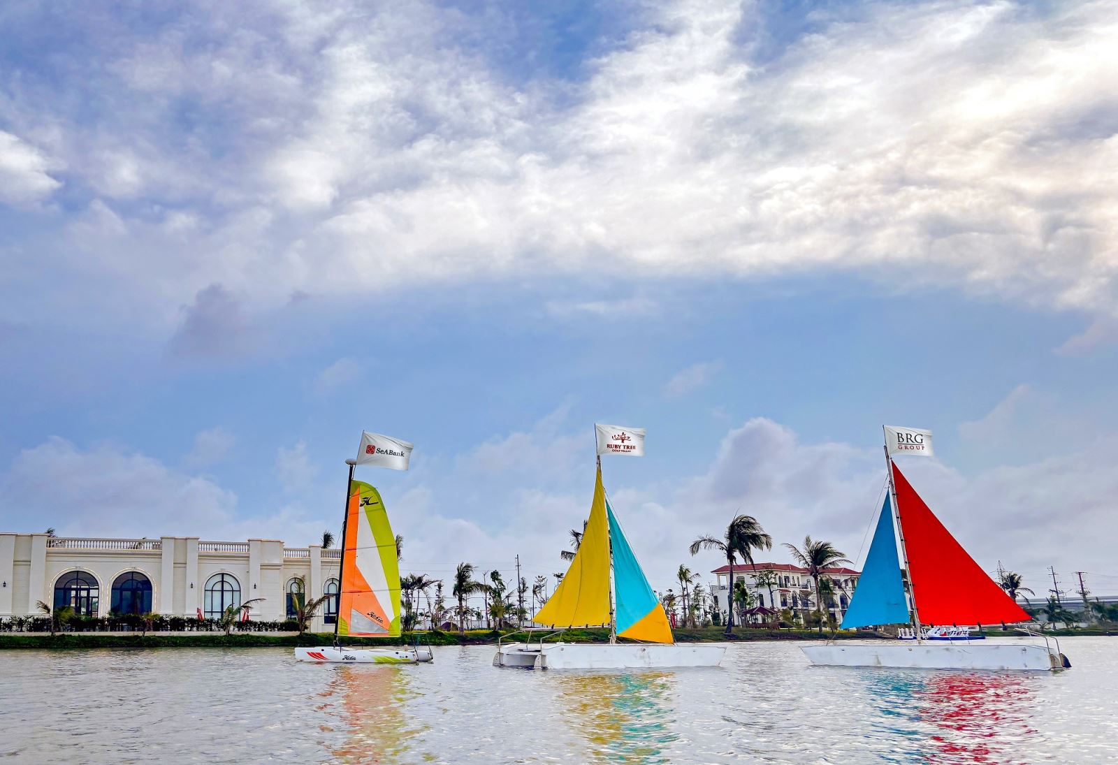 A group of sailboats on waterAI-generated content may be incorrect.