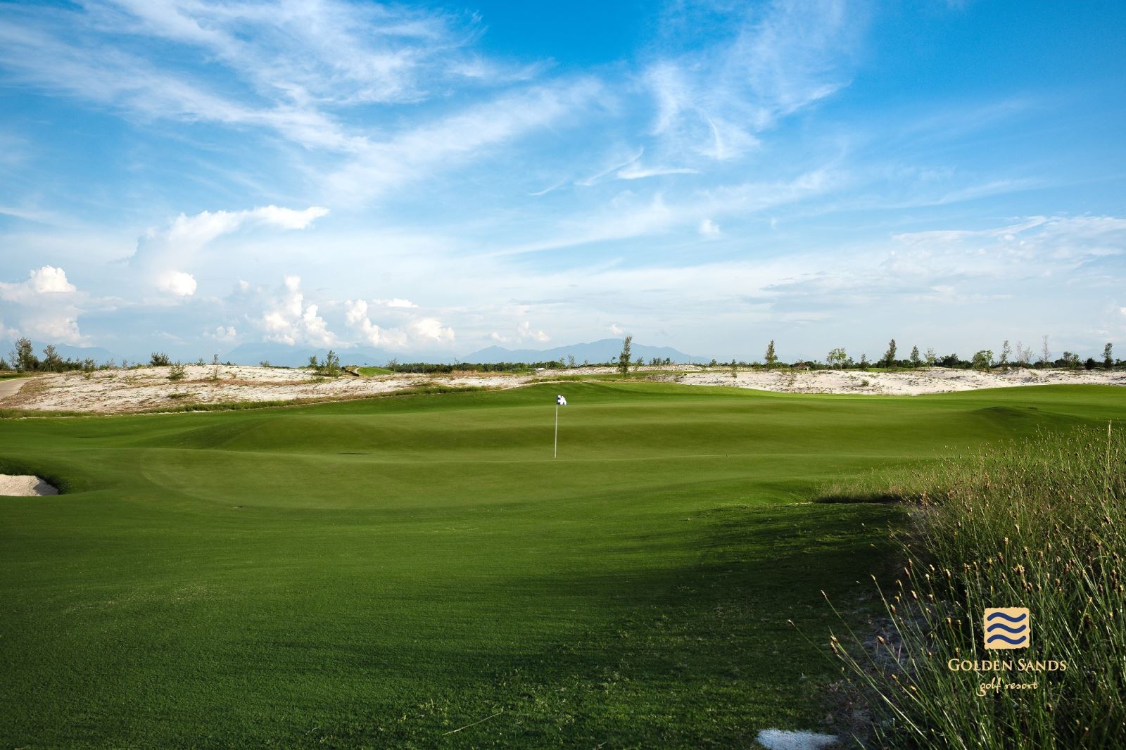 A golf course with a flag on the greenAI-generated content may be incorrect.